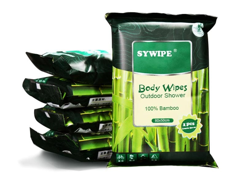 A stack of Sywipe extra-large bamboo body wipes, optimized for no-water cleaning during travel, sports, and outdoor activities.