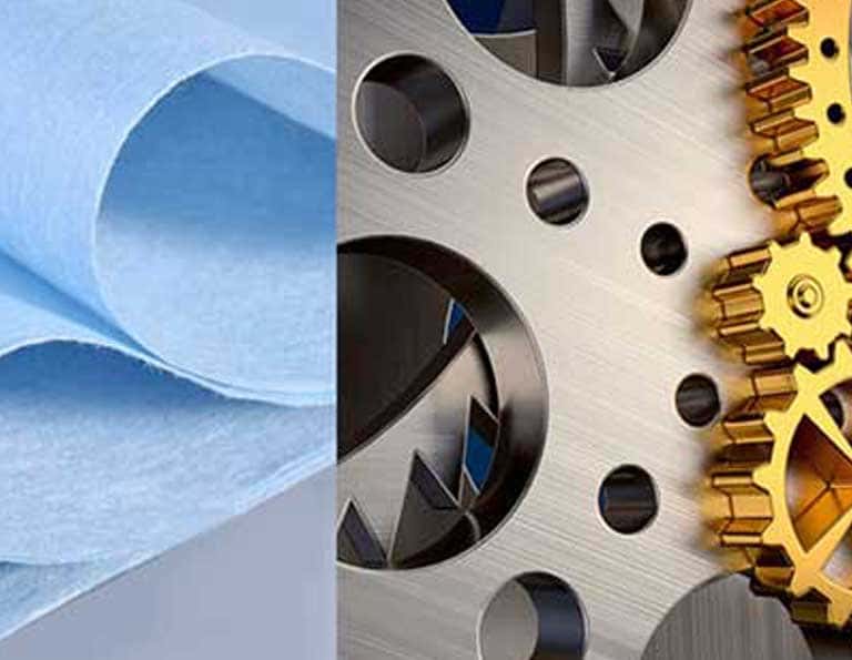 Heavy-duty blue industrial dry wiping cloth next to metallic machinery gears for demanding industrial cleaning and maintenance.