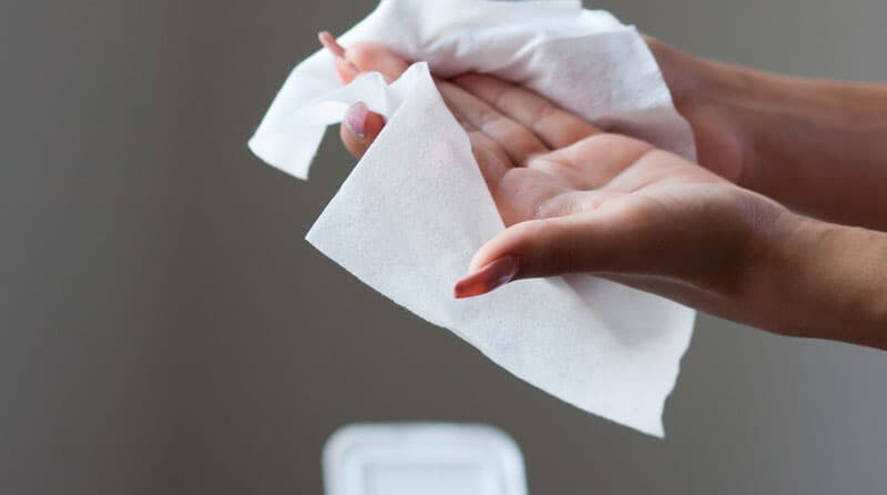 A person cleansing hands with high-quality spunlace medical wipes manufactured for healthcare and surface disinfection applications.